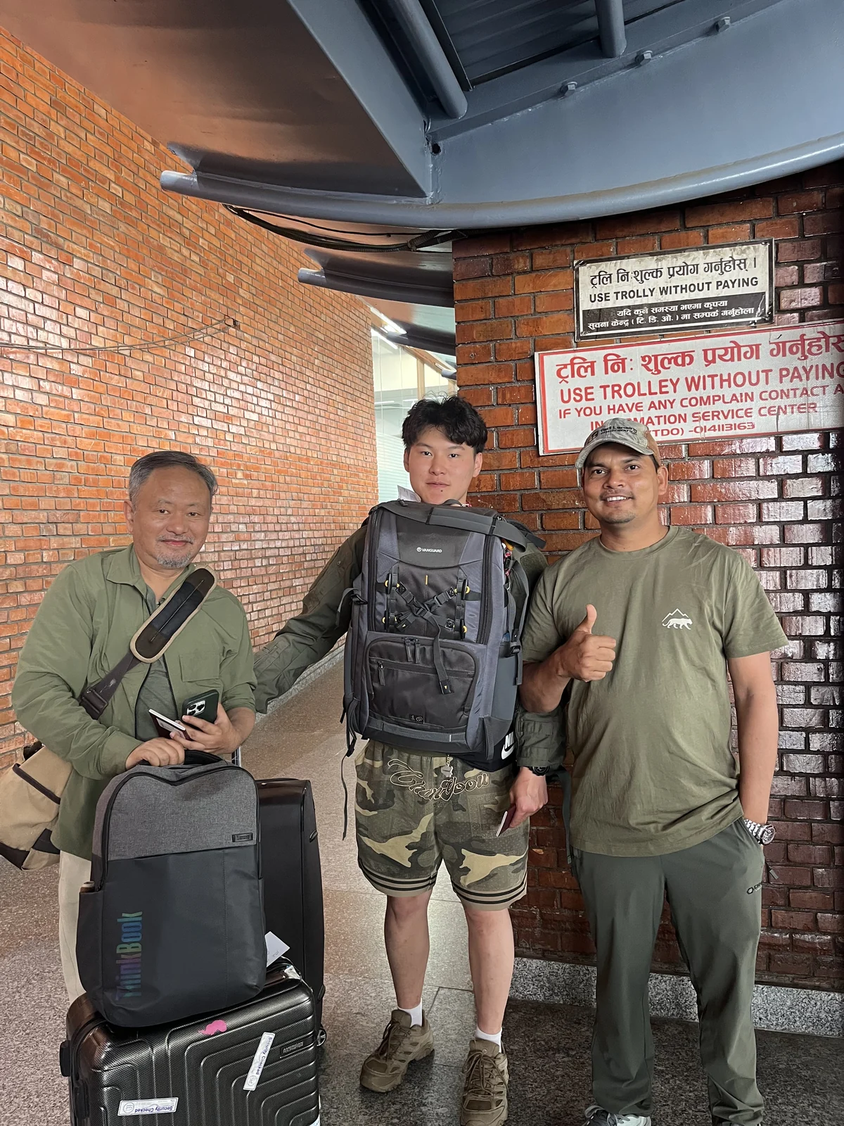Travelers with backpacks welcomed by our Nepali guide