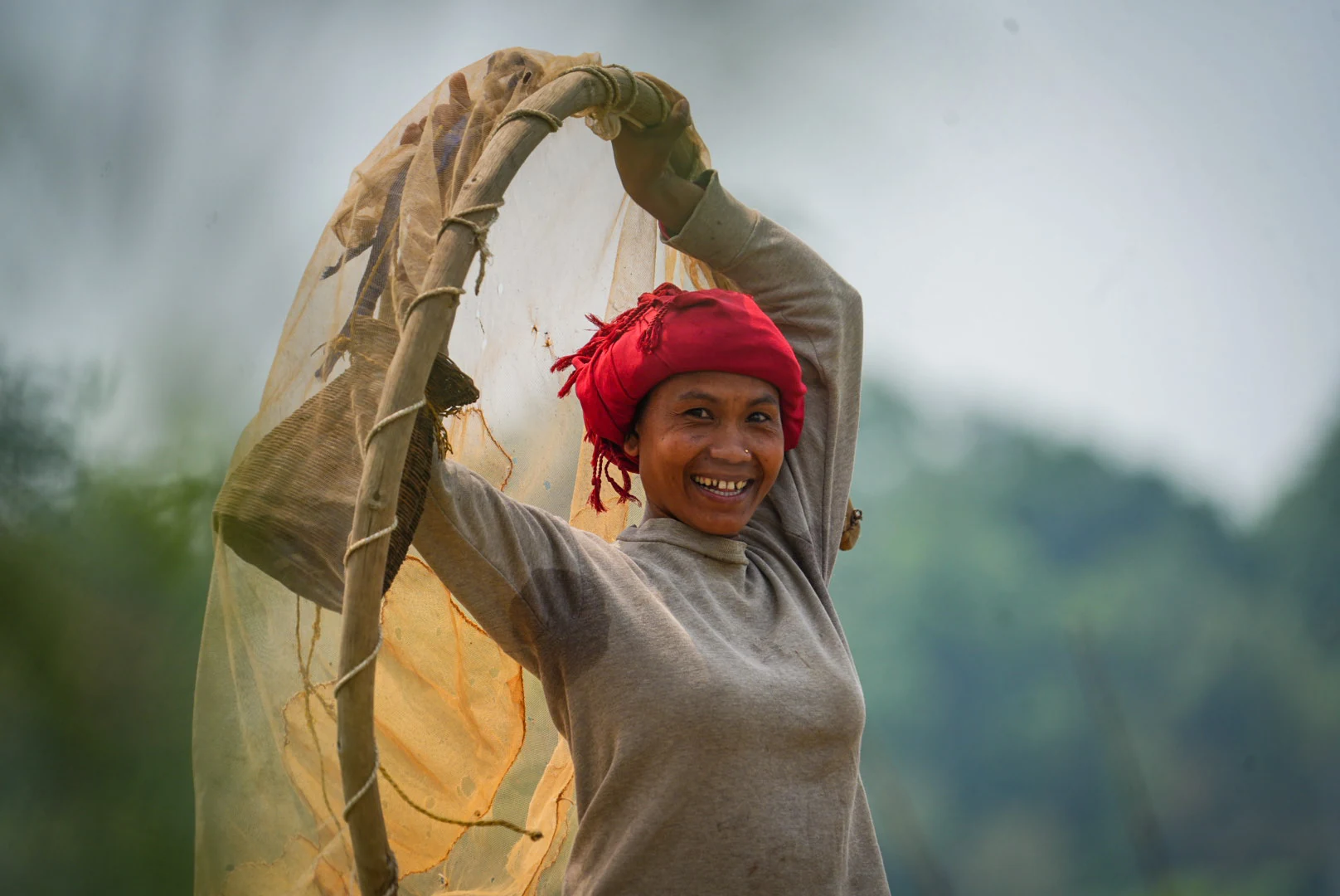 Traditional Tharu Fisherwoman in Terai - Wild Nepal Safari