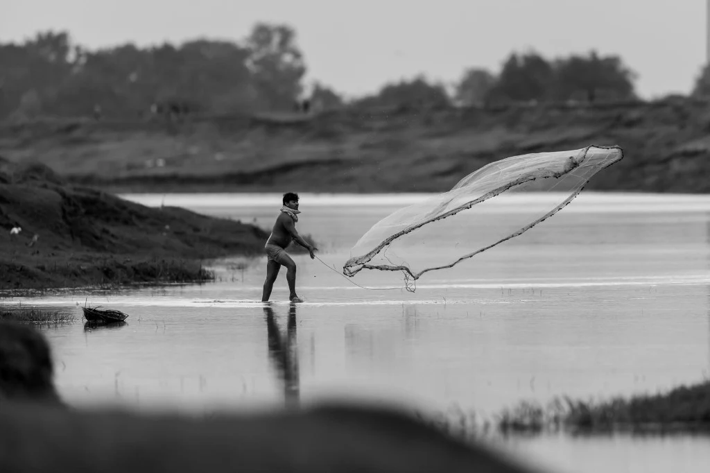 Traditional fisherman casting net - Bardia National Park